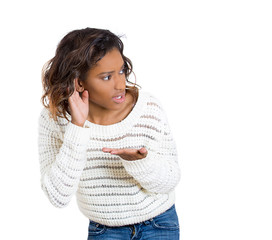 Portrait young nosy curious woman secretly listening
