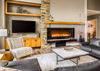 Furnished living Room in Luxury Home with Roaring Fireplace