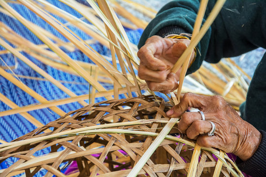 Weaving bamboo basket.