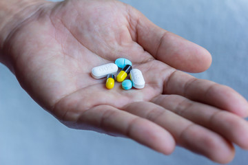 pills in man hand