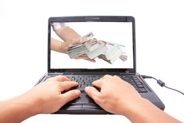 one computer with hand giving banknotes isolated on white