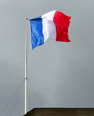 Flag of France, waving in the wind, in the sky