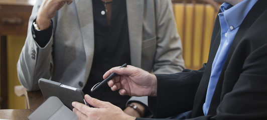 Pen pointing to the tablet.