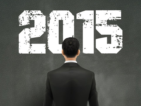 businessman looking at 2015 word