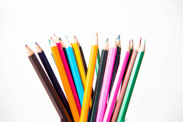 Fototapeta premium row of childrens coloured led crayon pencils.