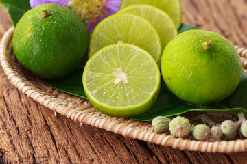 Lime on wooden background - Stock Image
