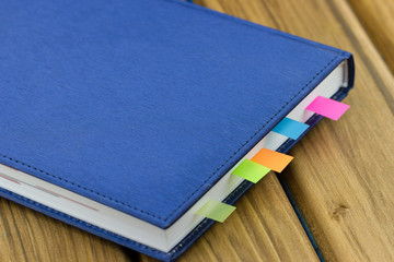 Close-up view of business diary with a colored bookmarks