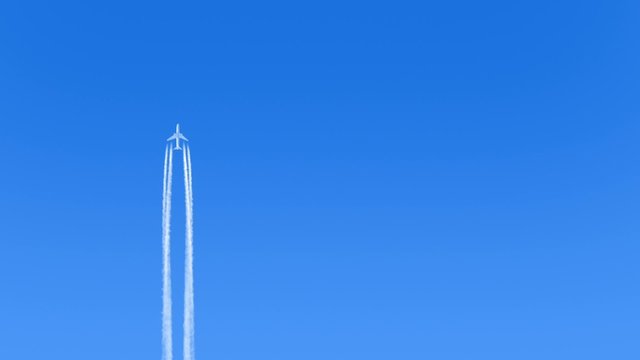Plane Flies Up Leaving Trail