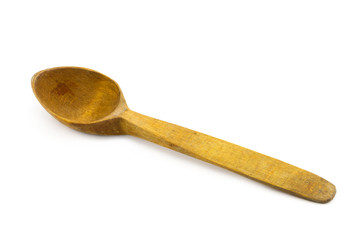 Old used wooden spoon isolated on white background