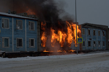Fire fighters try to save a home