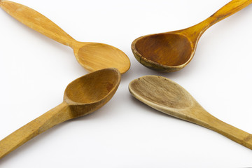 Group of different old used wooden spoon