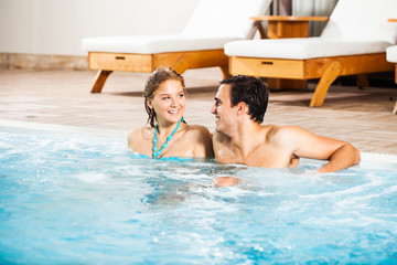 Happy couple in swimming pool