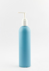 Blue plastic tubes of shampoo with batcher