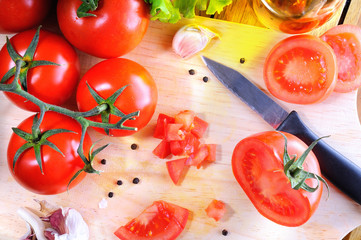 Tomatoes on a cutting board top view