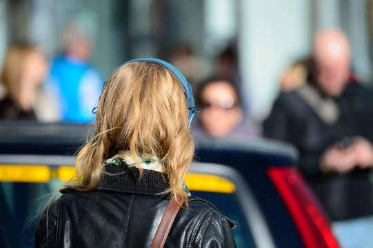 Blonde head in silhouette with headphones, Swedish woman
