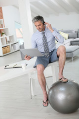 Businessman on video meeting from home in relaxed outfit