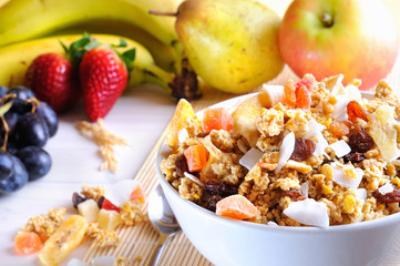 Bowl of cereal and fruits closeup
