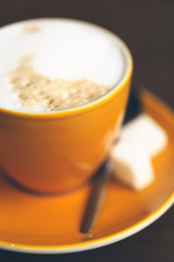 Yellow cup of Cappuccino
