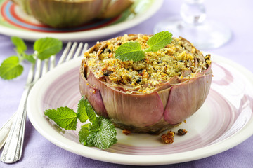 Vegetarian stuffed artichokes decorated with fresh mint