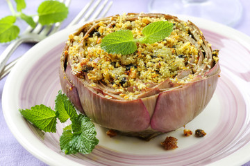 Vegetarian stuffed artichokes decorated with fresh mint