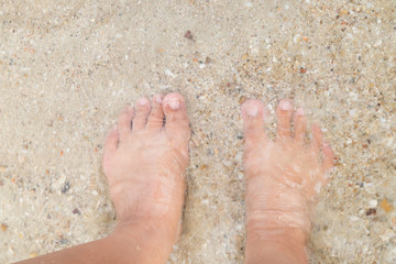 man legs on sandy beach