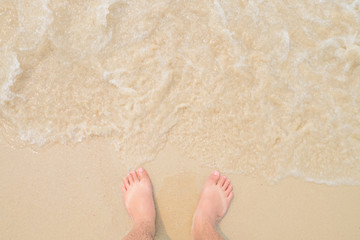man legs on sandy beach