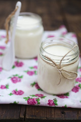 Fototapeta na wymiar two jars with yogurt