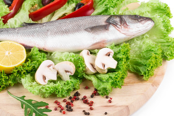 Fresh seabass fish on lettuce.