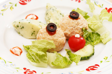 mashed potatoes and meatballs in the shape of a rabbit