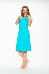 Woman fashion model in blue cocktail dress.