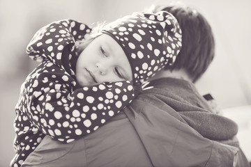 daughter on father shoulder