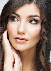 Woman face close up beauty portrait. Girl with long hair lookin