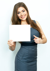 Naklejka premium Finger pointing. Smiling business woman hold white card.