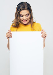 smiling woman looking on blank white card.