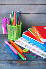 Colorful stationery on wooden background
