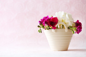 Beautiful spring flowers on light pink background