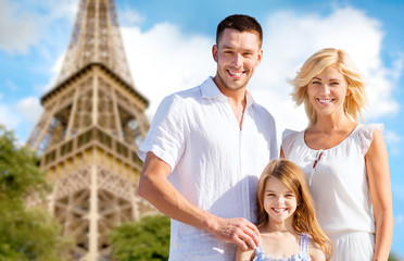 happy family in paris over eiffel tower background