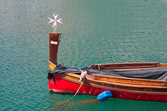 maltese row boat with cross