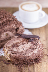 Whole Round Cake and Slice on Wood Table