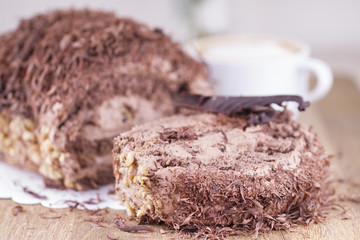 Whole Round Cake and Slice on Wood Table