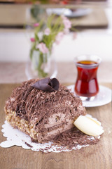 Whole Round Cake and Slice on Wood Table