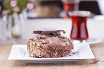 Whole Round Cake and Slice on Wood Table