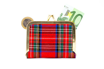 Wallet with euro coins and banknotes isolated
