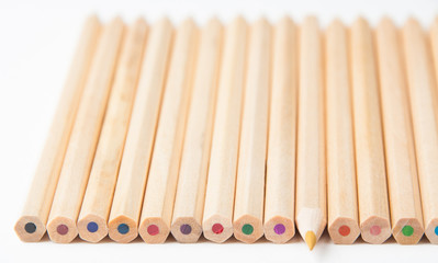 Colorful wooden pencils on white background