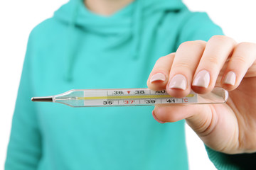 woman holding thermometer close up