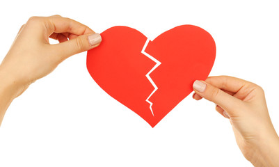 Female hands holding broken heart isolated on white