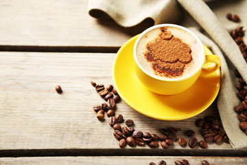 Cup of coffee on old wooden table