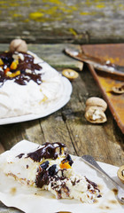 Pavlova with dried apricots, prunes, nuts, chocolate,
