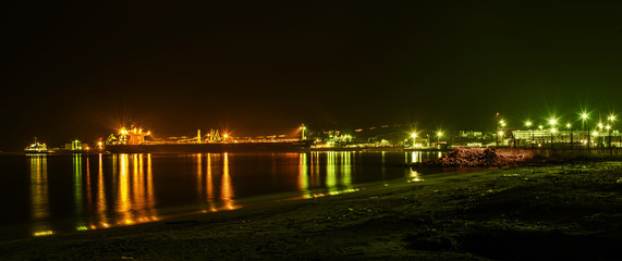 Panorama of sea port Burgas. Ships sand and reflections light.