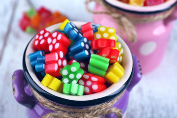 Sweet candies on wooden table, closeup